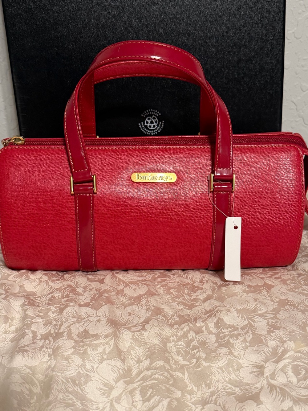 Burberrys Red Barrel Satchel with Gold Accents